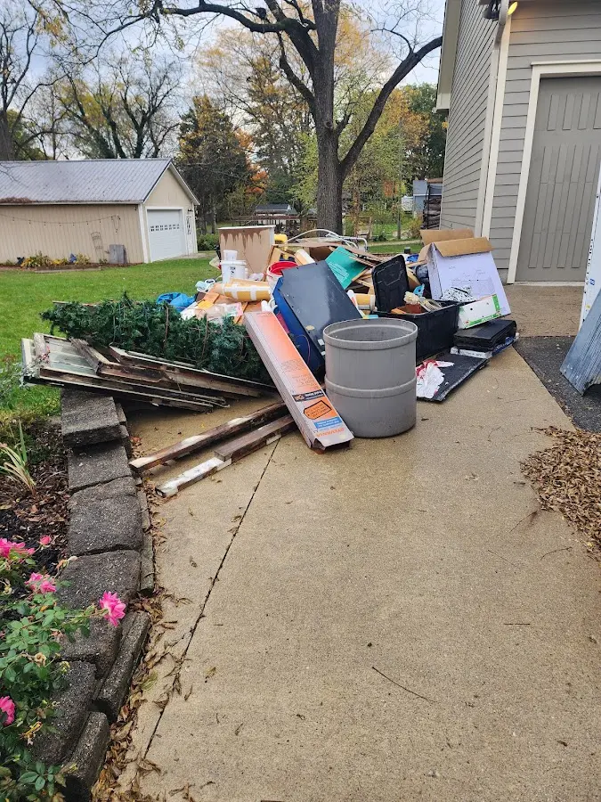 Dumpster being loaded with debris for 3 Yard Dumpster Rental in Conway